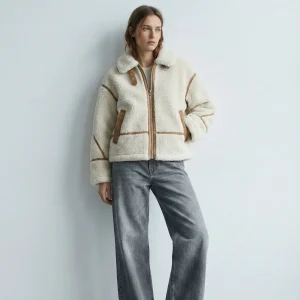 VESTE EFFET LAINE AVEC DÉTAILS CONTRASTÉS